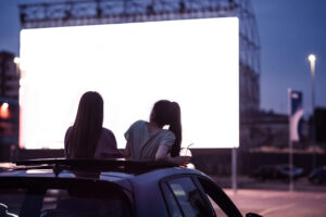 two people at drive in theater