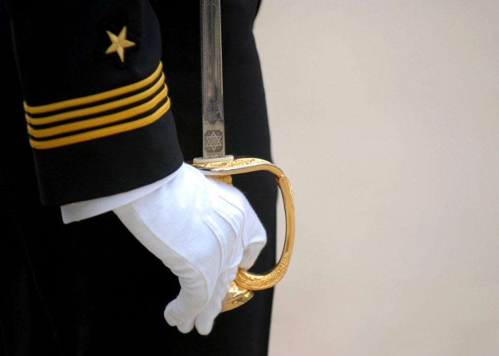sailor in uniform glove with sword