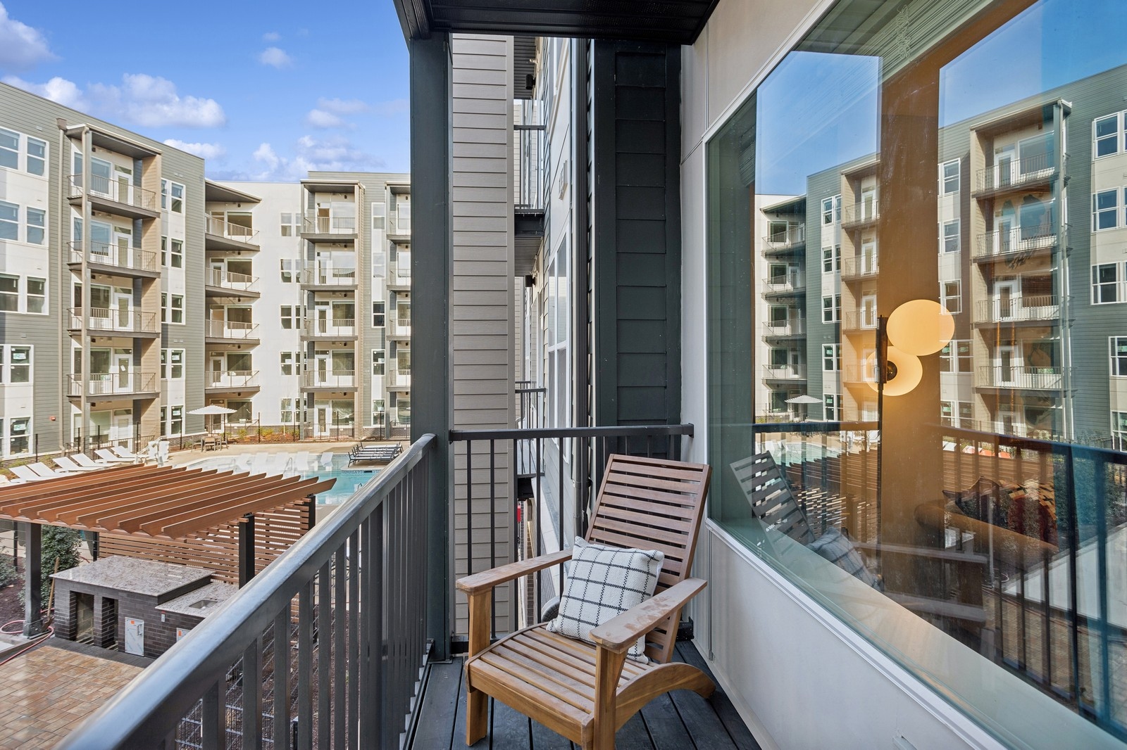 Apartment balcony with wicker chair