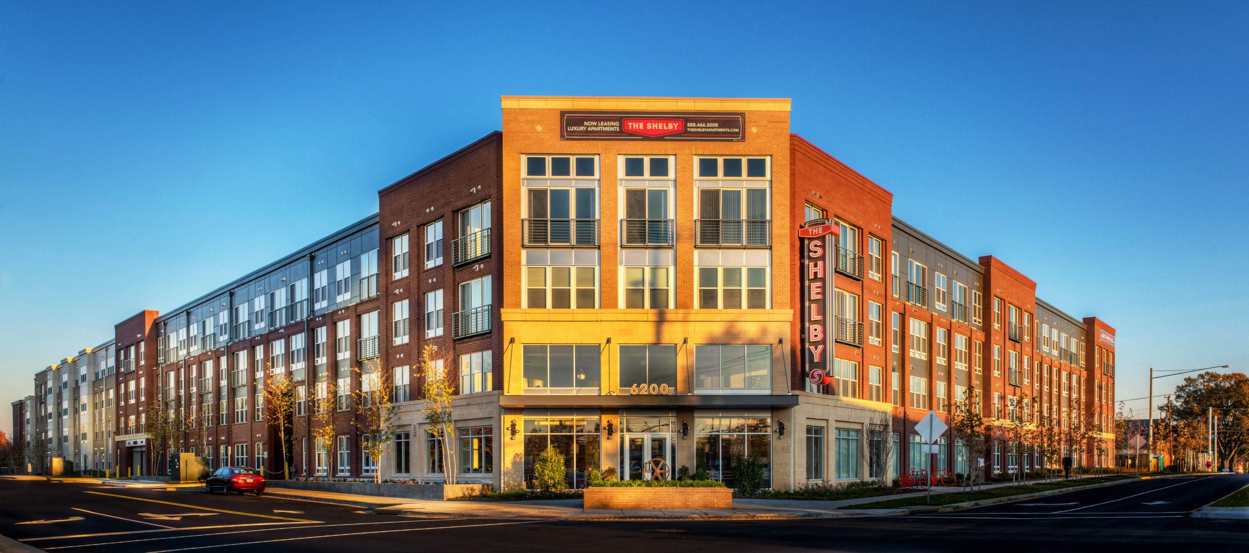 Three story building exterior with blue skies